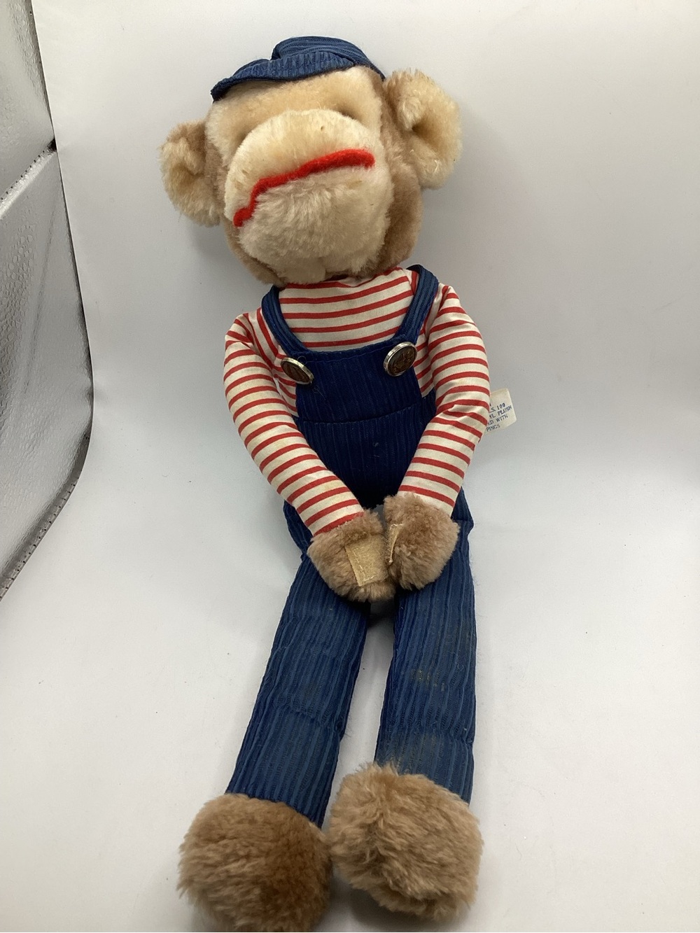 Vintage knee-hugger monkey with corduroy overalls and cap